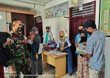 Personel Kodim 0208/Asahan Melaksanakan Monitoring Pendistribusian BLTDD