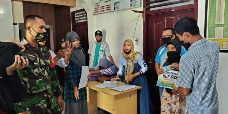 Personel Kodim 0208/Asahan Melaksanakan Monitoring Pendistribusian BLTDD Personel Kodim 0208/Asahan Melaksanakan Monitoring Pendistribusian BLTDD