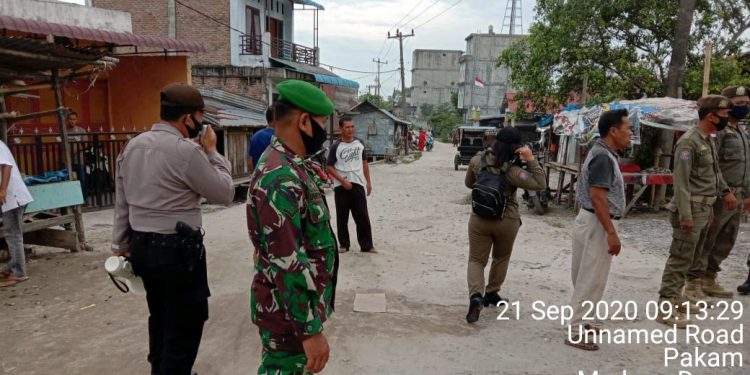 Personel Jajanran Kodim 0208/Asahan Mengingatkan Kepada Warga Masyarakat Untuk Selalu Pakai Masker