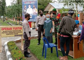 Personel Kodim 0208/Asahan Lakukan Upaya Peningkatan Kewaspadaan Covid-19 Melalui Sosialisasi