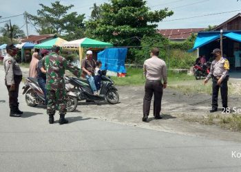 Jajaran Kodim 0208/Asahan Bekerjasama Dengan Polsek Datuk Bandar Dalam Memberantas Virus Corona