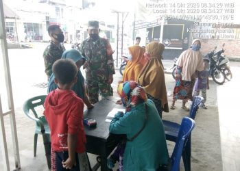 Anggota Kodim 0208/Asahan Pimpin Kegiatan Himbauan Protkes