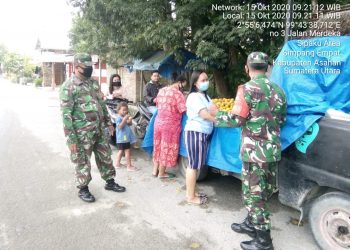 Personel Kodim 0208/Asahan Himbau Dan Ajak Masyarakat Selalu Pakai Masker Di Luar Rumah