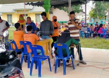Penyaluran Dana BST, Polsek Perbaungan Pastikan Masyarakat Patuhi Protokol Kesehatan