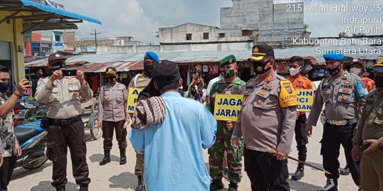 Personil Jajaran Kodim 0208/Asahan Melaksanakan Pendisiplinan Aman Covid-19 Melalui Patroli