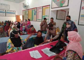 Jajaran Kodim 0208/Asahan Melaksanakan Pengamanan Pembagian Penyaluran BLT Dana Desa