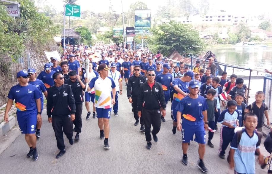 Kirab Obor Asian Games 2018, Team Polres Simalungun Sukses Antarkan Obor Hingga Ke Balige