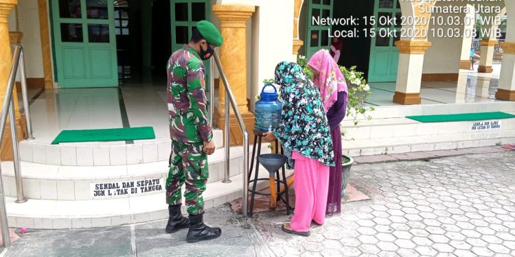 Personel Babinsa Kodim 0208/Asahan Serukan Himbauan Penanganan Pencegahan Covid-19 Kepada Masyarakat